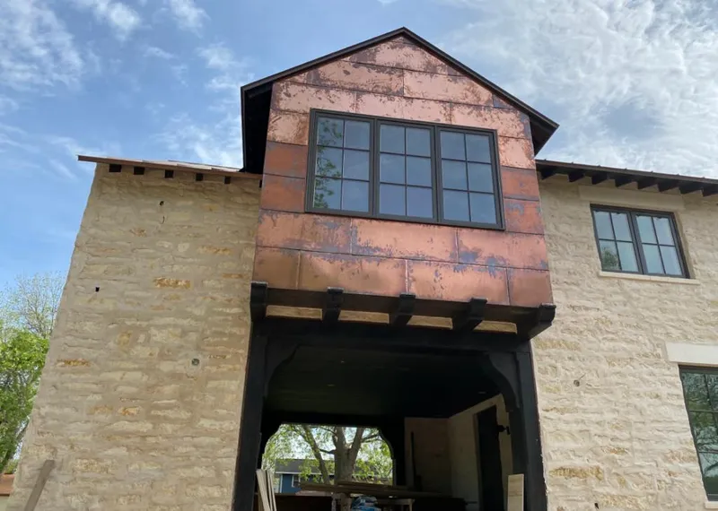 Copper metal panel facade on a stone building for Metal Roof Coating in Amory